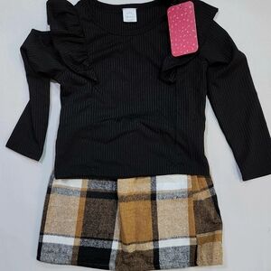 Chic Black Top with Plaid Skirt